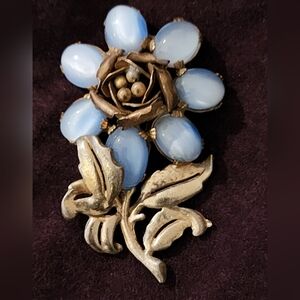 Vintage dress clip from the 30s plated pot metal with Moonglow lucite